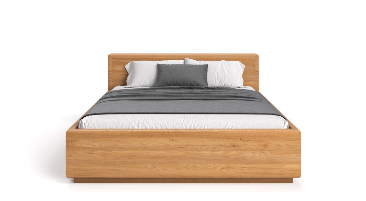 Designer Holzbett Calveno aus massiver Eiche mit Stauraum und geraden Headboard