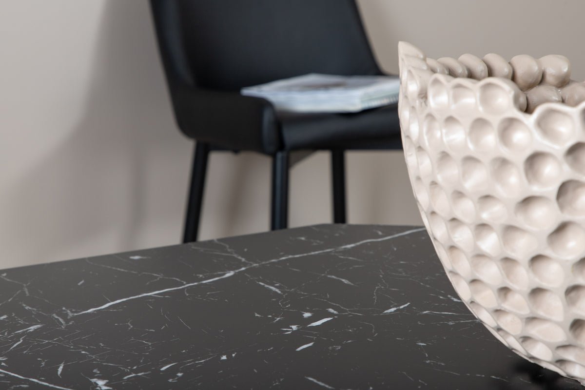 Dining table Orani - rests on a robust frame that combines stability and design