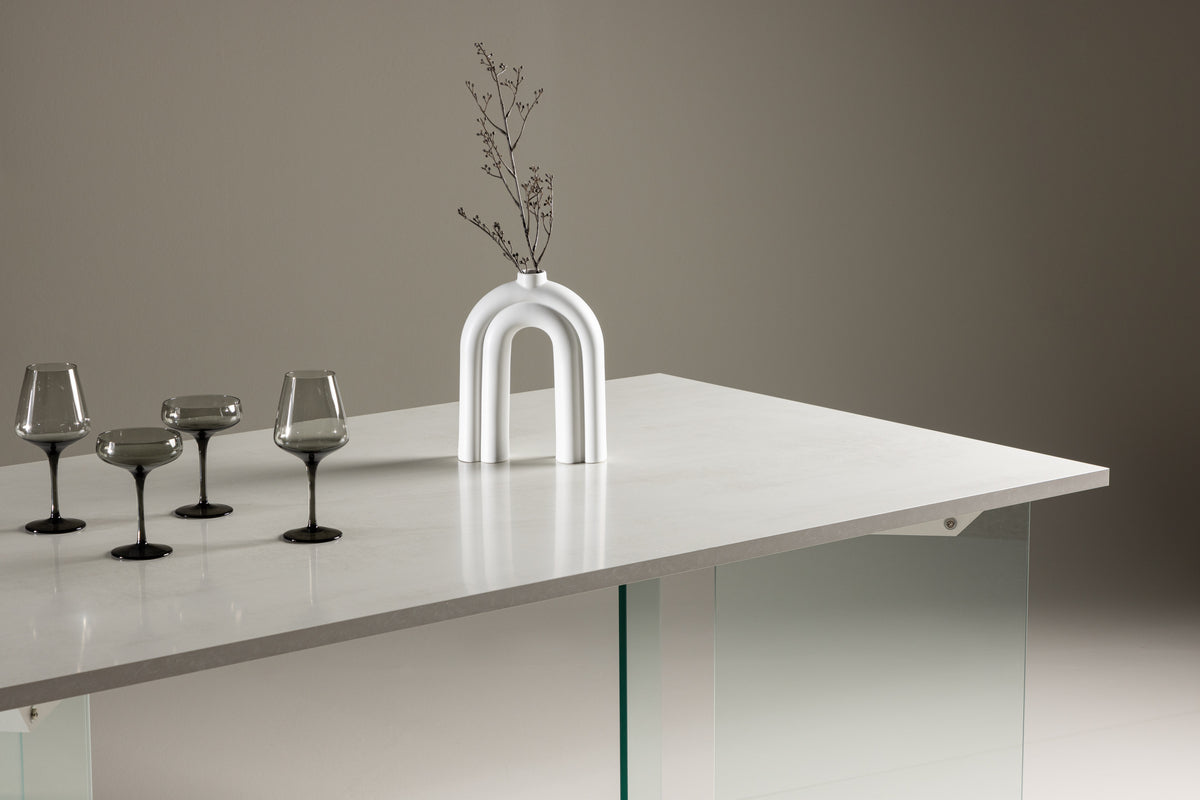 Esstisch Brevon - moderner Esstisch auf einem Glasgestell mit hellgrauer Tischplatte