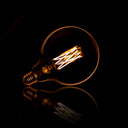 LED Incandescent Bulb Veya – G125-E27 in Large Format with Amber-Colored Glass
