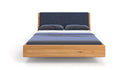Designer wooden bed Cassian made of solid oak in a floating appearance