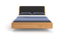 Designer wooden bed Cassian made of solid oak in a floating appearance