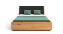 Designer wooden bed Cassian made of solid oak with storage space