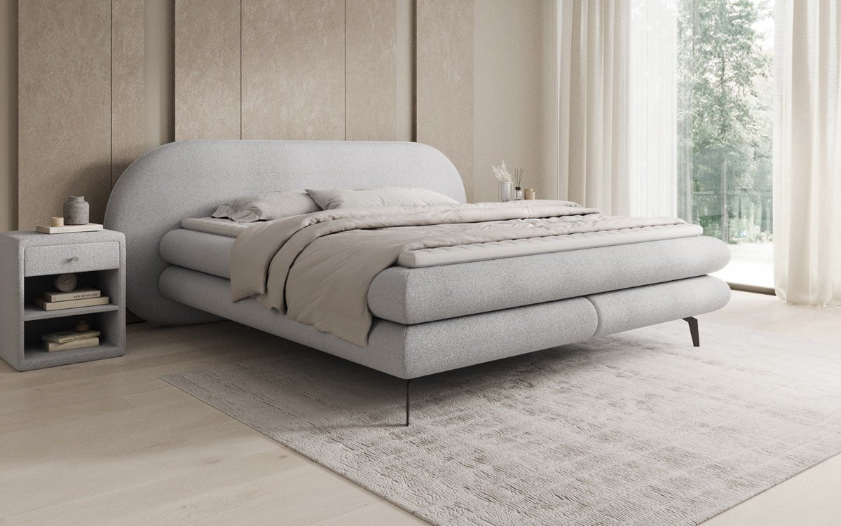 Box spring bed Marisol with oval headboard in bouclé
