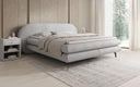 Box spring bed Marisol with oval headboard in bouclé