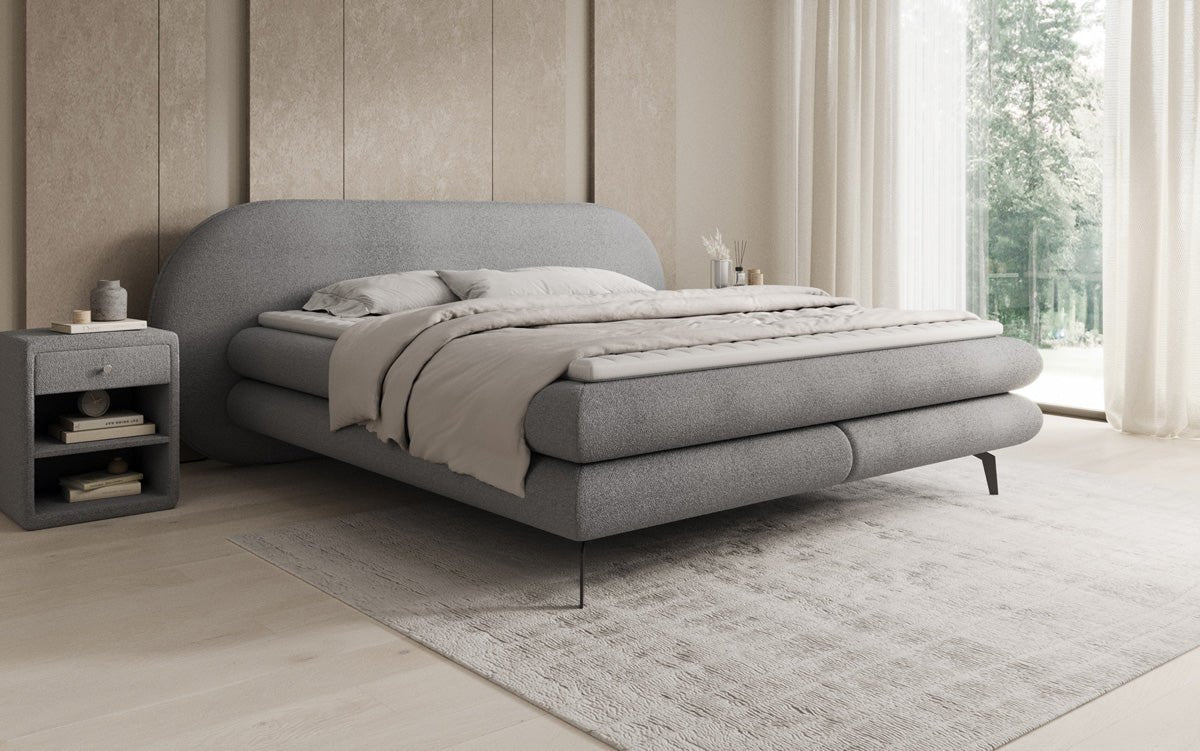 Box spring bed Marisol with oval headboard in bouclé