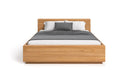 Designer wooden bed Calveno made of solid Oak with storage and straight headboard