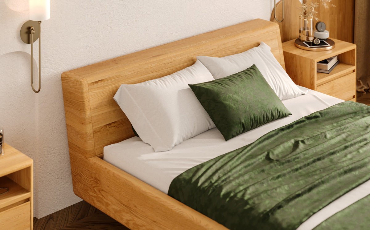 Designer wooden bed Arvelo made of solid Oak with floating appearance and slanted headboard