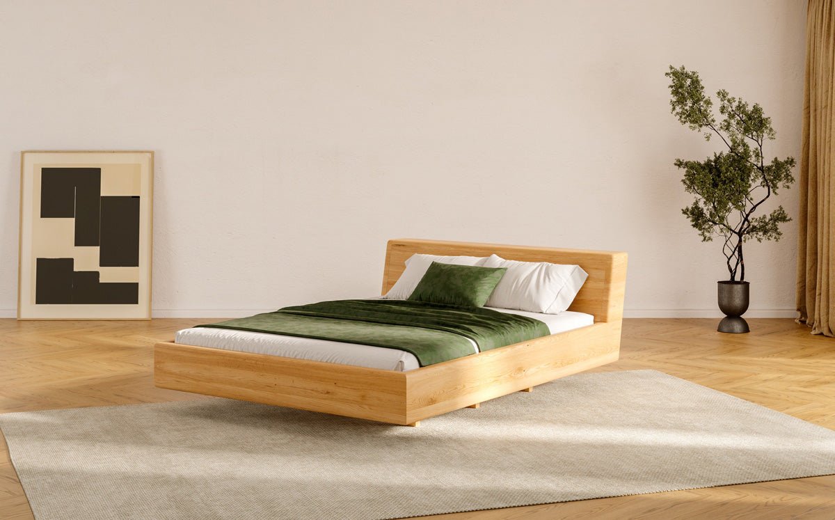 Designer wooden bed Arvelo made of solid Oak with floating appearance and slanted headboard