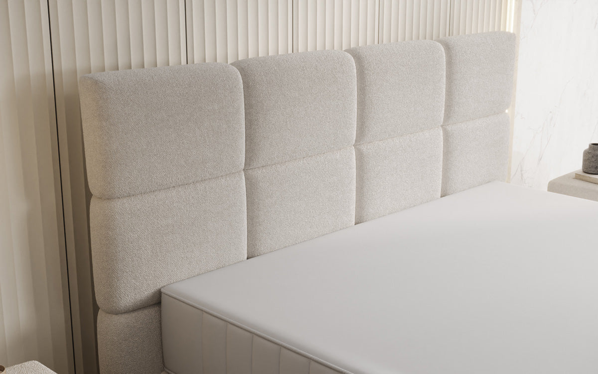 Nessa box spring bed with high legs in teddy bouclé