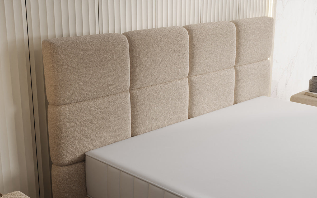 Nessa box spring bed with high legs in teddy bouclé